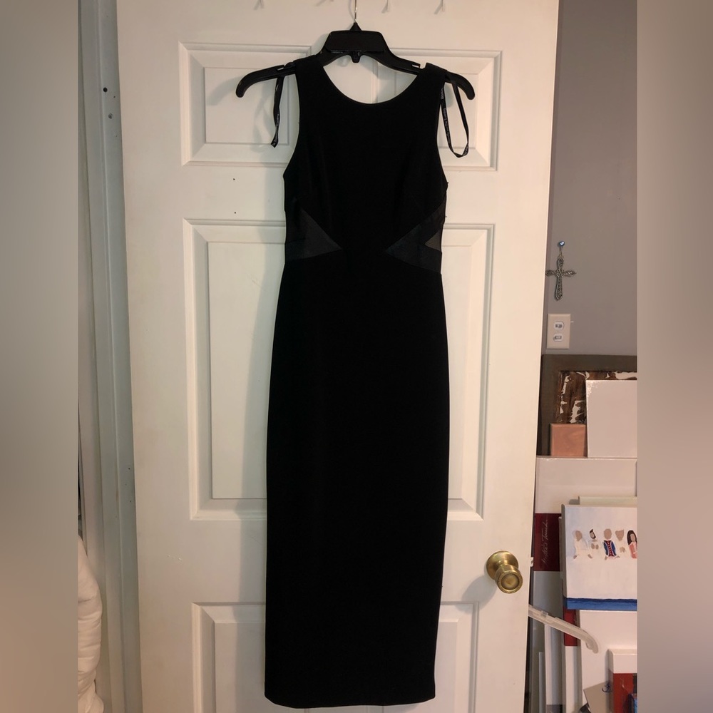 Beautiful black evening gown by Blondie and me size 3/4. Perfect for Christmas.